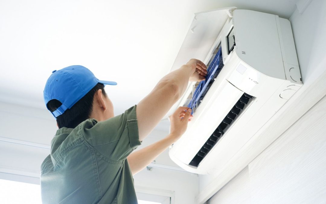 Air conditioning technician maintaining an indoor mini split system in Herriman, UT